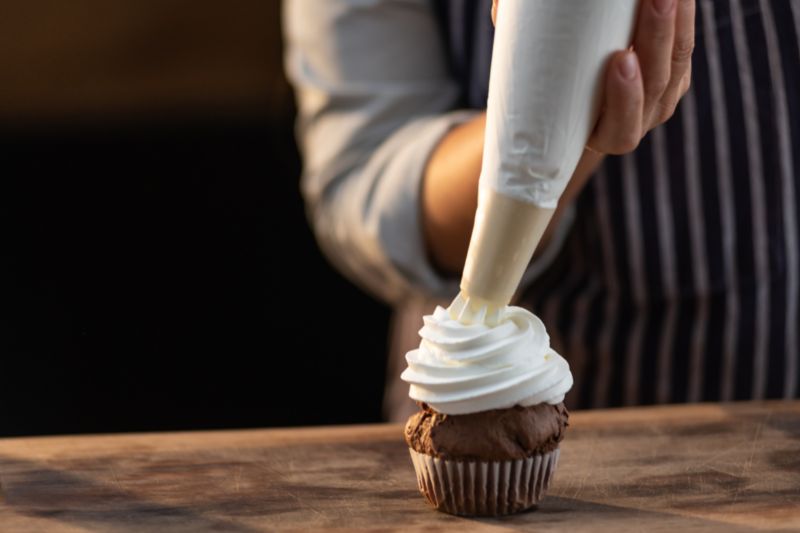 whipped cream on cupcake